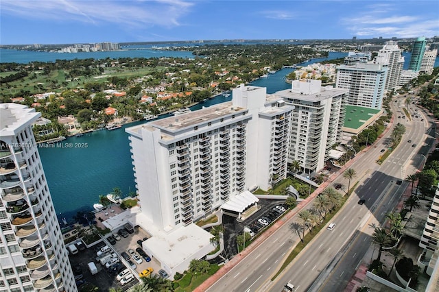 birds eye view of property featuring a water view and a city view