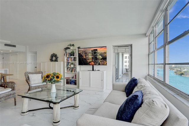 living room featuring visible vents and marble finish floor