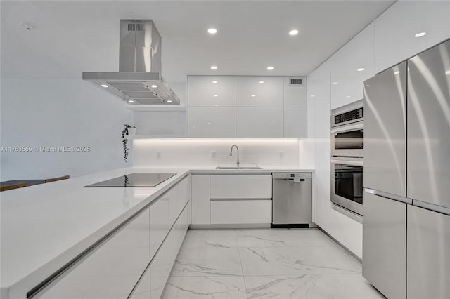 kitchen featuring modern cabinets, white cabinets, island exhaust hood, and appliances with stainless steel finishes