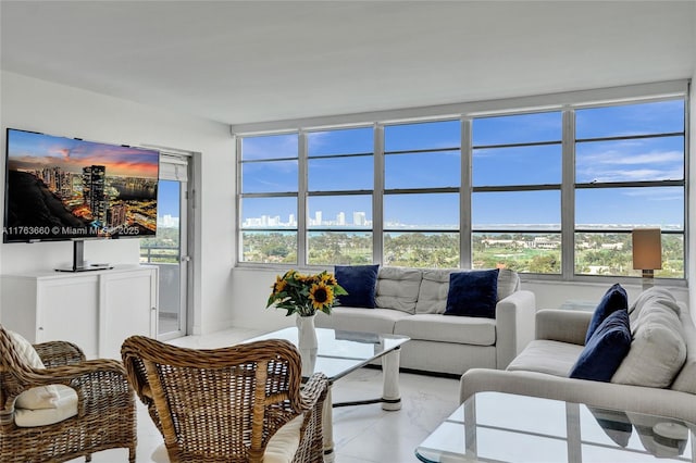 living area featuring a wealth of natural light and a city view