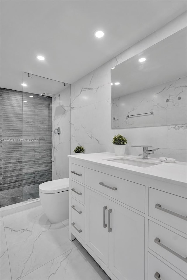 full bath with tile walls, stone wall, marble finish floor, and a shower stall