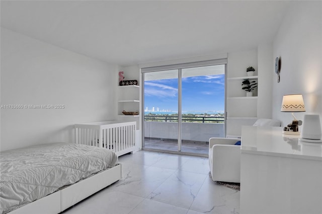 bedroom featuring marble finish floor and access to outside