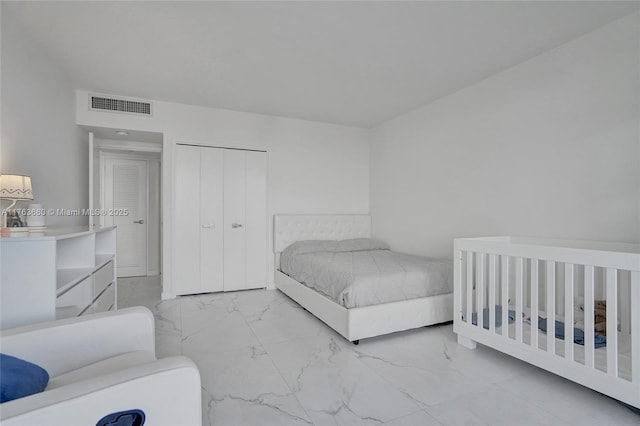 bedroom with visible vents and marble finish floor