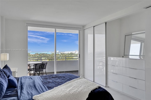 bedroom with access to exterior, visible vents, and marble finish floor