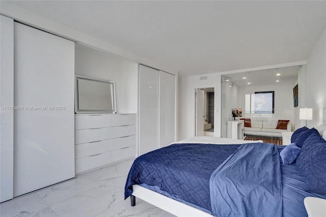 bedroom featuring visible vents, recessed lighting, ensuite bathroom, a closet, and marble finish floor