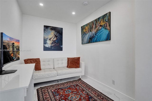 living area with recessed lighting, baseboards, and marble finish floor