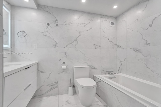 full bath featuring vanity, visible vents, a tub with marble appearance, recessed lighting, and toilet