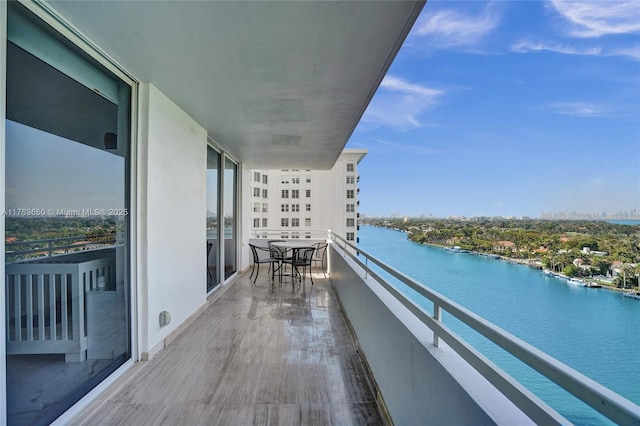 balcony featuring a water view