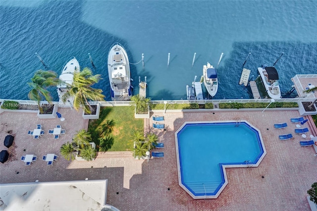 birds eye view of property with a water view