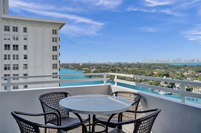 balcony with a city view and a water view