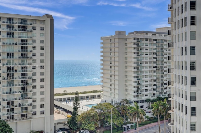 exterior space featuring a view of the beach and a water view