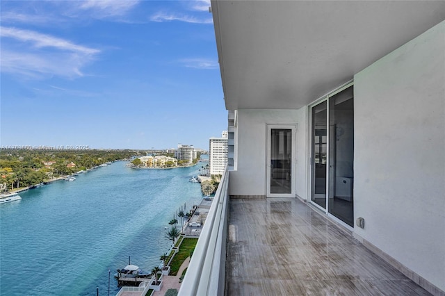 balcony featuring a water view