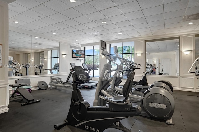 exercise room featuring a drop ceiling and recessed lighting