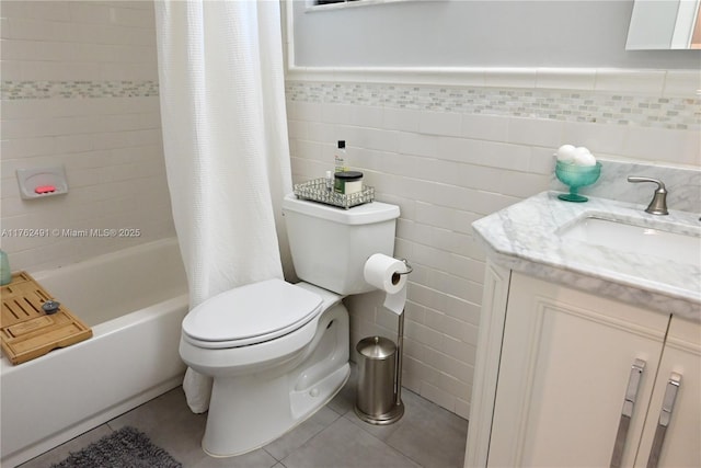 bathroom featuring toilet, vanity, tile patterned floors, tile walls, and shower / bathtub combination with curtain