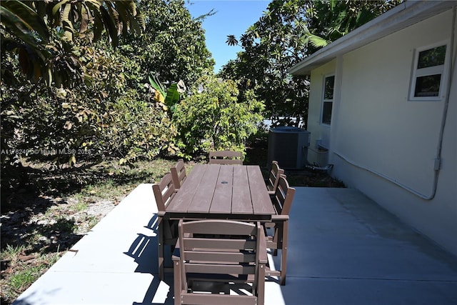 view of patio / terrace with outdoor dining space and central AC