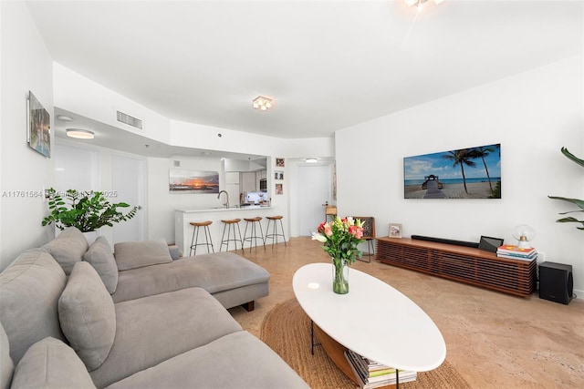 living room featuring visible vents