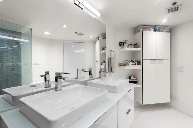 full bath featuring tile patterned flooring, visible vents, recessed lighting, and a sink