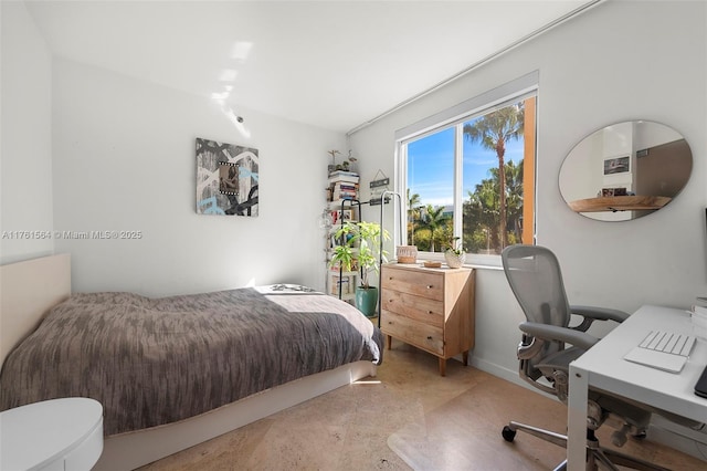 bedroom featuring finished concrete floors