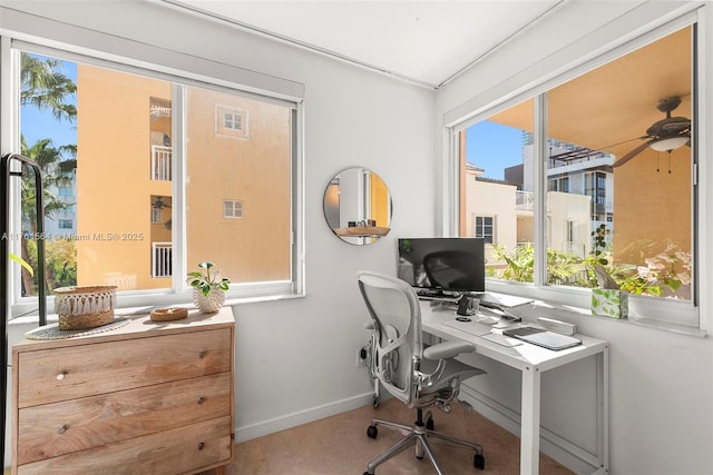 office area featuring visible vents, a ceiling fan, and baseboards