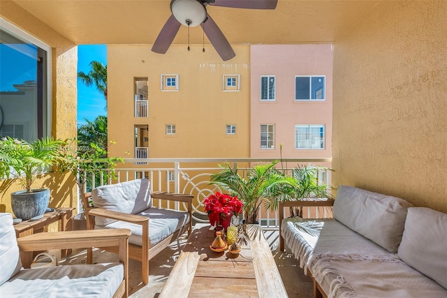 balcony with an outdoor hangout area and ceiling fan