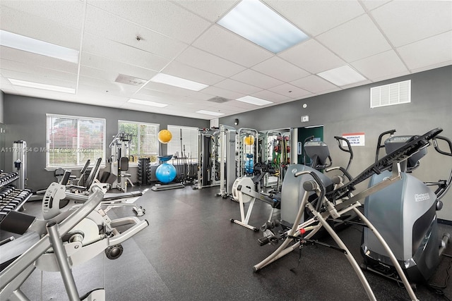 gym featuring a drop ceiling and visible vents