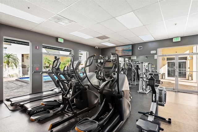 workout area featuring a drop ceiling