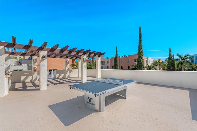 view of patio / terrace featuring a pergola and a residential view