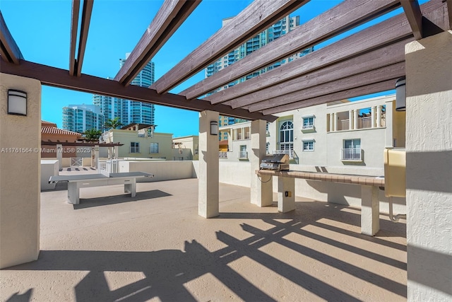 view of patio featuring a city view and a pergola