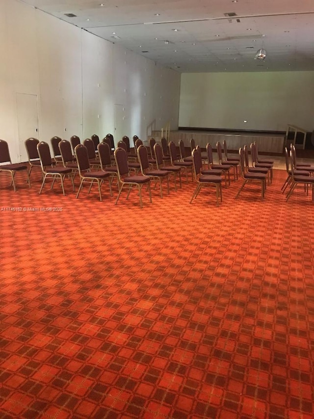 misc room with a towering ceiling
