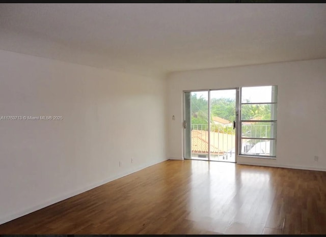 unfurnished room featuring wood finished floors