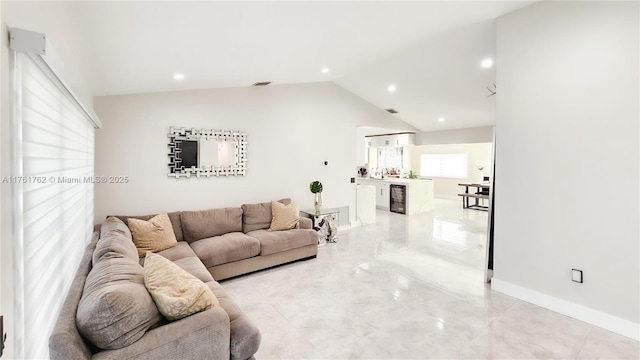 living area with visible vents, recessed lighting, baseboards, and vaulted ceiling