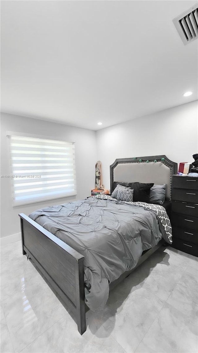 bedroom featuring recessed lighting, visible vents, marble finish floor, and baseboards