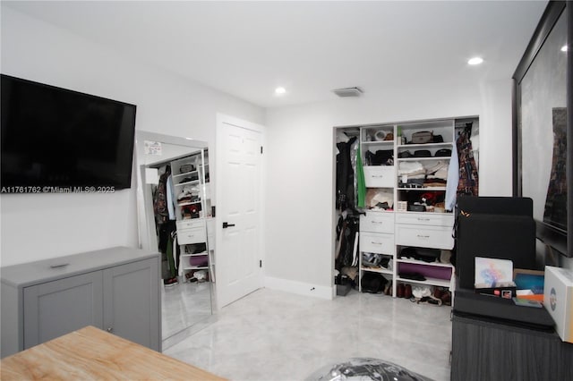 interior space with recessed lighting, visible vents, and baseboards