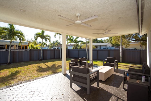 view of patio featuring a fenced backyard and a ceiling fan