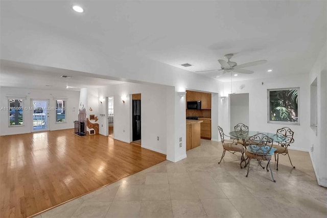 unfurnished dining area featuring light tile patterned floors, visible vents, recessed lighting, and a ceiling fan