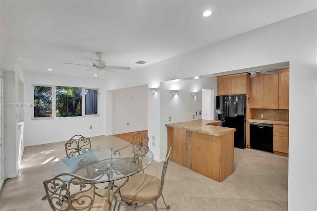 kitchen featuring a ceiling fan, a peninsula, decorative backsplash, black appliances, and light countertops