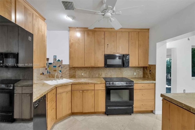 kitchen featuring black appliances, a sink, light countertops, decorative backsplash, and ceiling fan