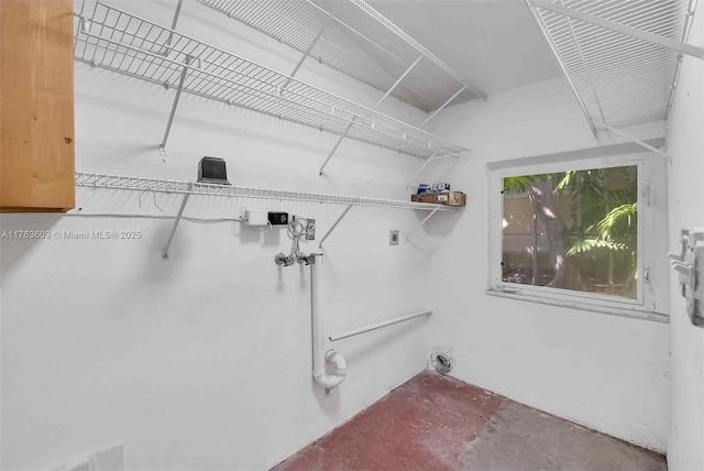 laundry room with hookup for an electric dryer, washer hookup, and laundry area