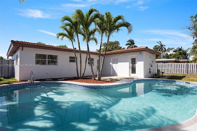 view of swimming pool featuring a fenced in pool and fence