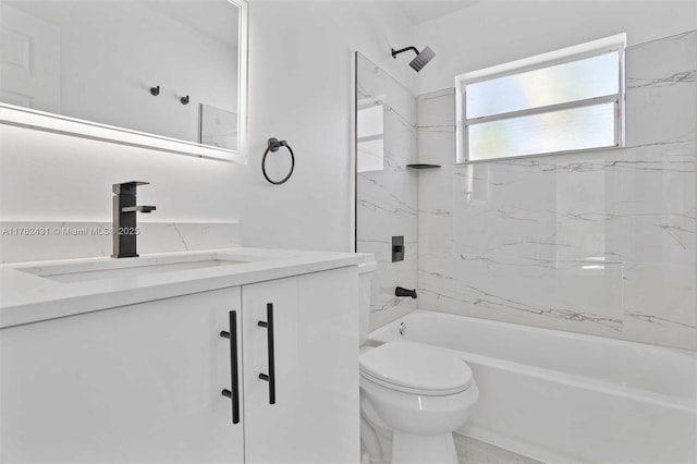 bathroom with vanity, shower / bathing tub combination, and toilet