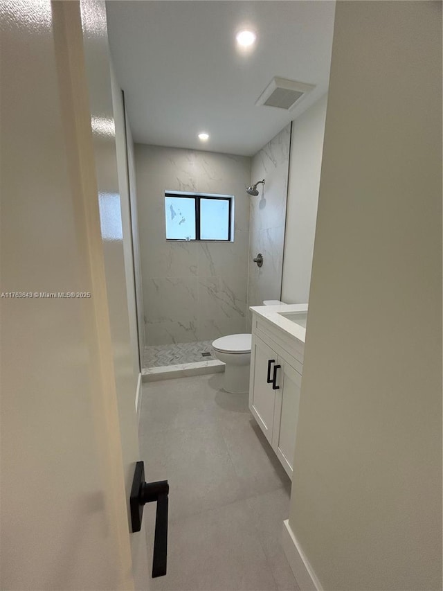 full bathroom featuring vanity, a marble finish shower, recessed lighting, toilet, and visible vents