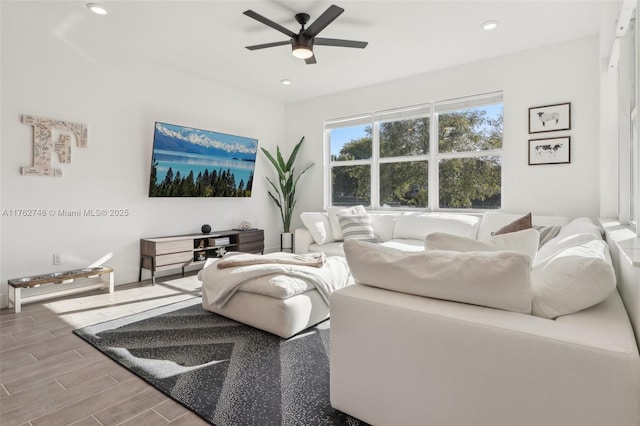 living area featuring recessed lighting, a ceiling fan, and wood finish floors