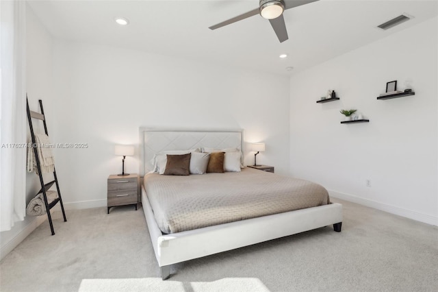 bedroom with light carpet, visible vents, recessed lighting, and baseboards