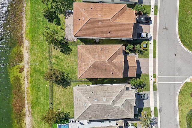 birds eye view of property featuring a water view