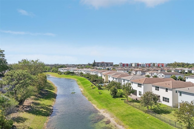 aerial view featuring a residential view and a water view