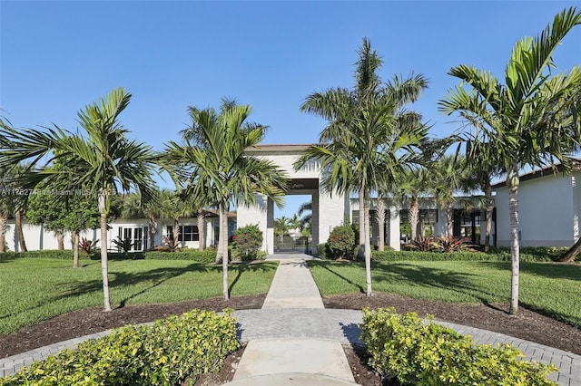 view of home's community with a lawn