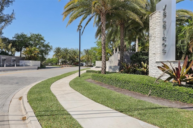 view of road featuring curbs, street lights, and sidewalks