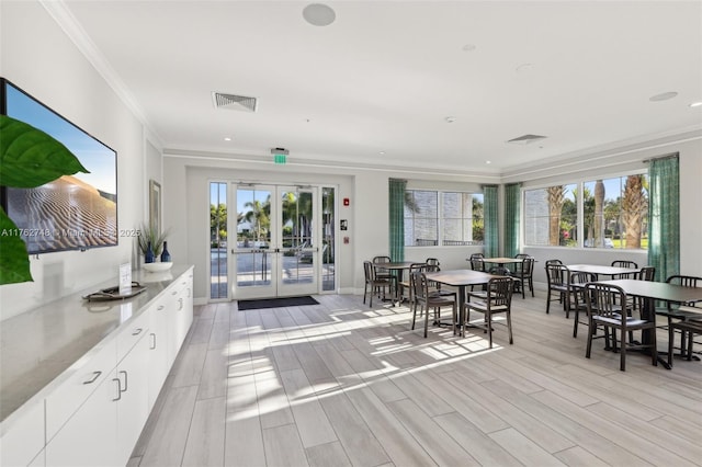 interior space with outdoor dining space, french doors, and visible vents