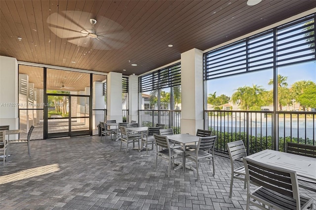 view of patio / terrace featuring outdoor dining space and a ceiling fan