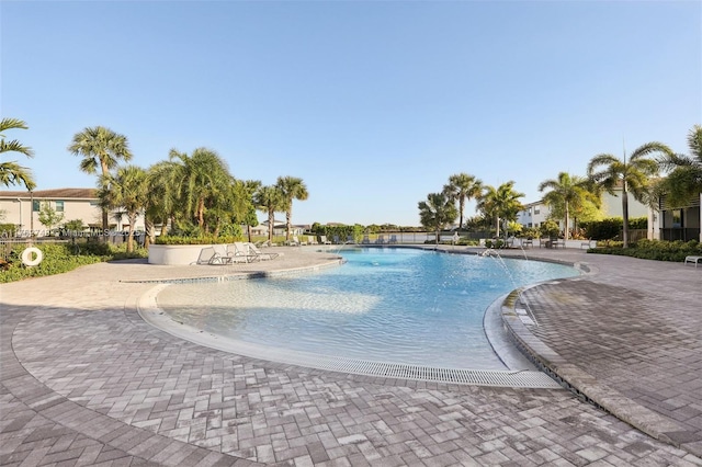 community pool with a patio area